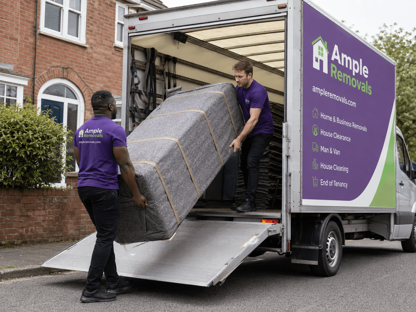 Ample Removals movers loading furniture into a branded van